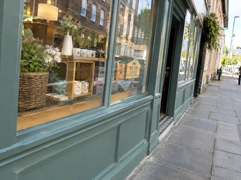 A shop front photographed from a steep angle along the pavement